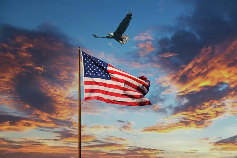 american-flag-on-old-flagpole-at-sunset-with-eagle-darryl-brooks